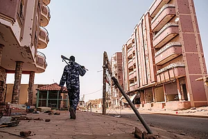 via Getty : An armed policeman walk in the area of the Souk, in the city of Omdurman, Sudan, on June 15, 2024.