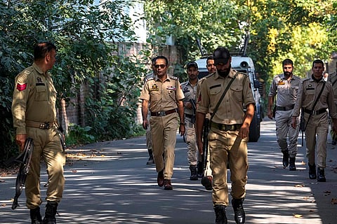 J&K Polls 2024: Policemen patrol near a venue for distribution of election material