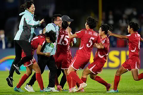 U-20 Women's World Cup, North Korean vs Japan: North Korea's coach Ri Song Ho, left, celebrates with players after their team defeated Japan