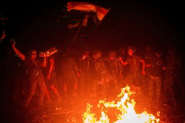via Getty Images : Members of Karenni Resistance Force celebrate mission accomplishment in their base, in Shadaw Township.