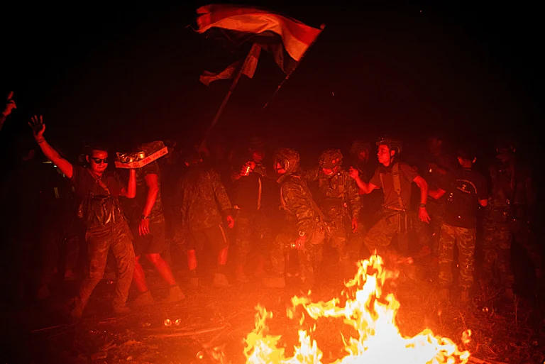 Members of Karenni Resistance Force celebrate mission accomplishment in their base, in Shadaw Township. - via Getty Images