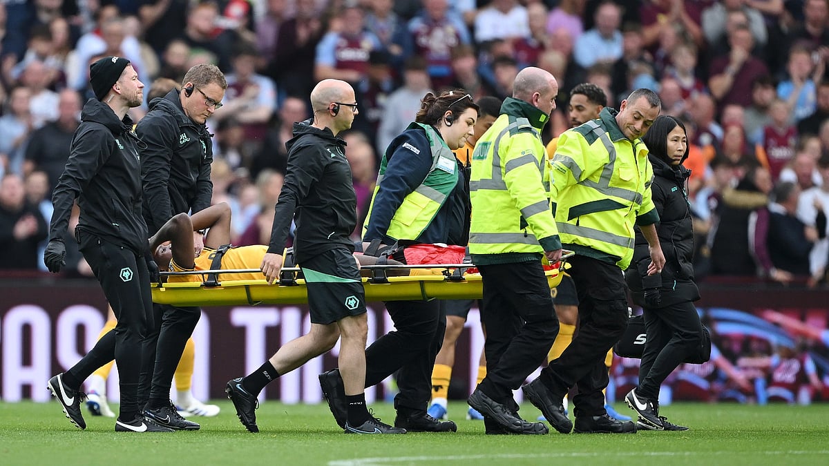 Wolves defender Yerson Mosquera was stretchered off against Aston Villa - null