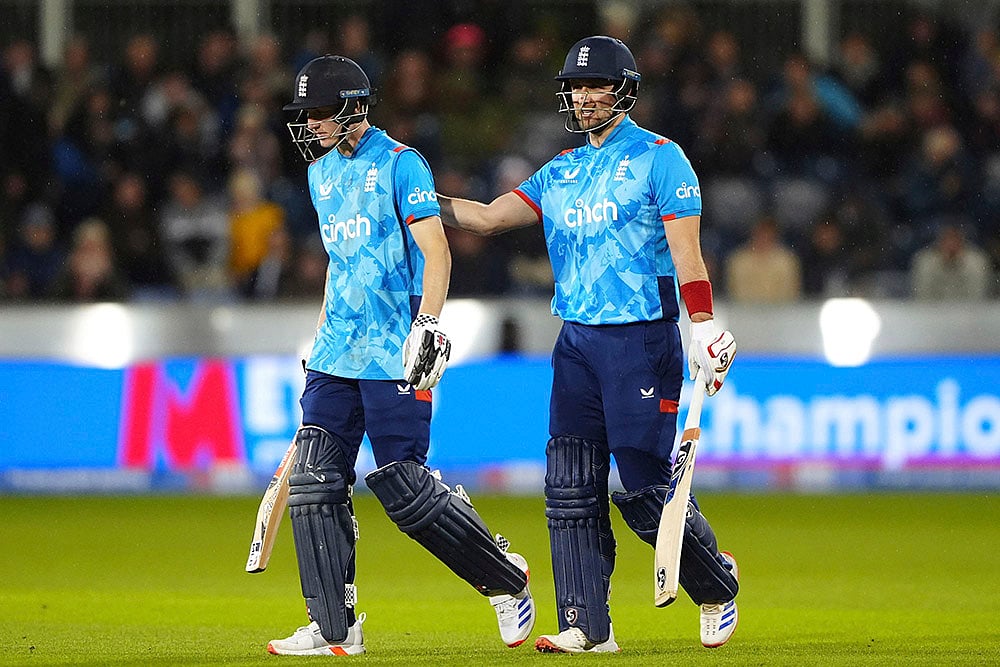 | Photo: Owen Humphreys/PA via AP : England vs Australia 3rd ODI: England's Harry Brook and Liam Livingstone leave the pitch as rain stops play 