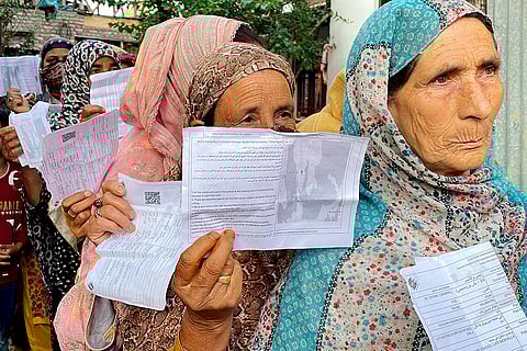 J&K Assembly elections, 2nd Phase voting: Women voters stand in a queue to cast their votes in Srinagar