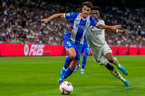 La Liga 2024-25, Real Madrid vs Alaves: Real Madrid's Aurelien Tchouameni, right, duels for the ball with Alaves' Ander Guevara