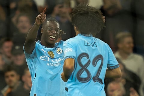 English League Cup, Manchester City vs Watford: Manchester City's Jeremy Doku, left, celebrates after scoring a goal