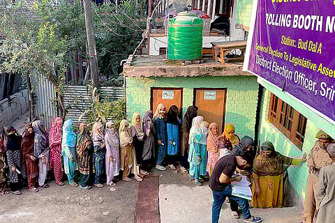 J&K Assembly elections, 2nd Phase voting: Voters stand in a queue at a polling station in Srinagar
