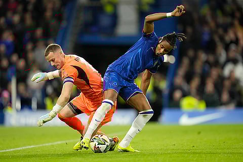 English League Cup, Chelsea vs Barrow: Chelsea's Christopher Nkunku, right, challenges for the ball with Barrow's goalkeeper Paul Farman