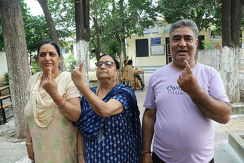 J&K Assembly elections, 2nd Phase voting: Kashmiri migrants show their inked fingers in Jammu