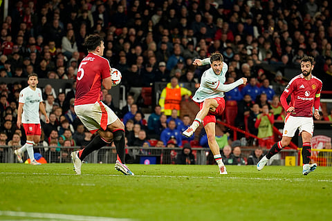 UEFA Europa League, Manchester United vs Twente: Twente's Ricky van Wolfswinkel, centre, shoots the ball as Manchester United's Harry Maguire blocks