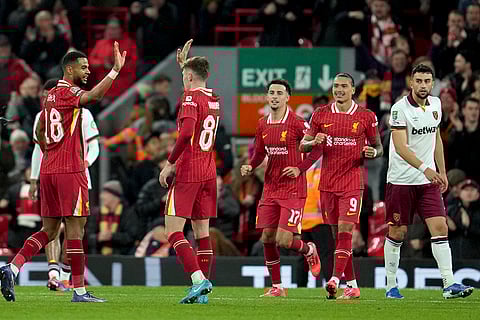 EFL Cup, Liverpool vs West Ham: Liverpool's Cody Gakpo, left, celebrates after scoring his side's fourth goal