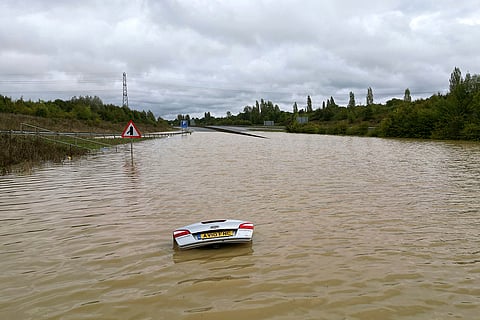 Britain Weather: A view of an open boot of a car visible, submerged in flood water after heavy rainfall