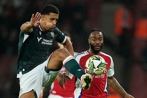 EFL Cup, Arsenal vs Bolton Wanderers: Bolton's Chris Forino-Joseph, left, controls a ball