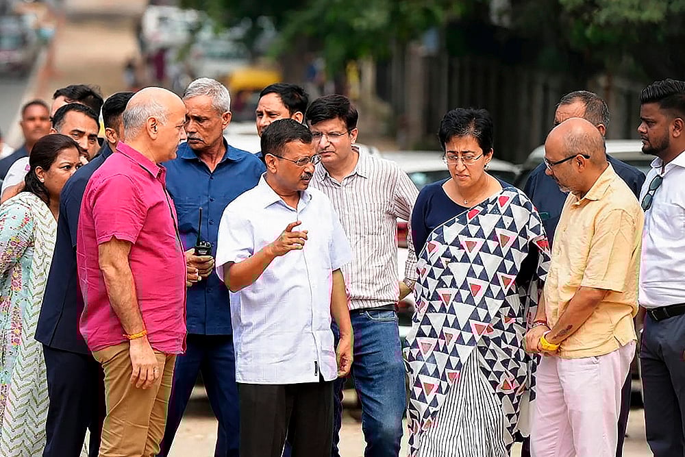 | Photo: PTI : Atishi inspects roadwork in DU area