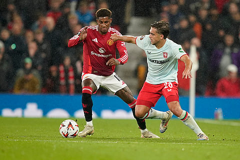 UEFA Europa League, Manchester United vs Twente: Manchester United's Marcus Rashford, left, and Twente's Bart van Rooj challenge for the ball