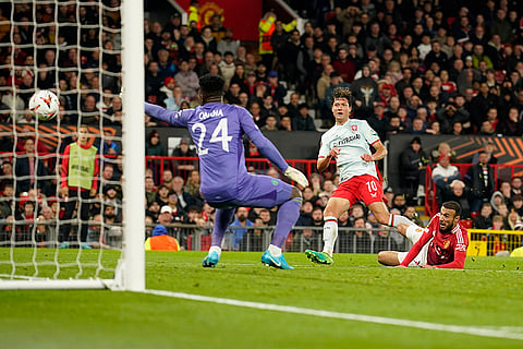 UEFA Europa League, Manchester United vs Twente: Twente's Sam Lammers, centre, scores his side's first goal past Manchester United's goalkeeper Andre Onana