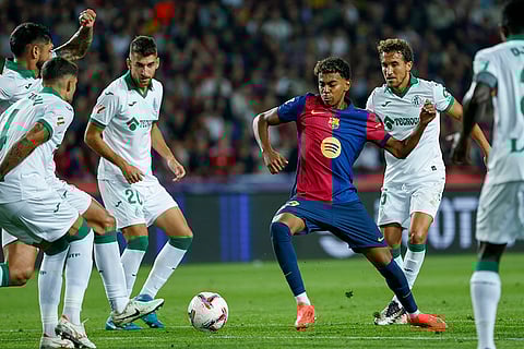 La Liga 2024-25, Barcelona vs Getafe: Barcelona's Lamine Yamal, center, controls the ball