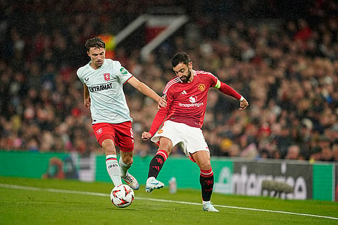 UEFA Europa League, Manchester United vs Twente: Bruno Fernandes, right, and Twente's Youri Regeer challenge for the ball