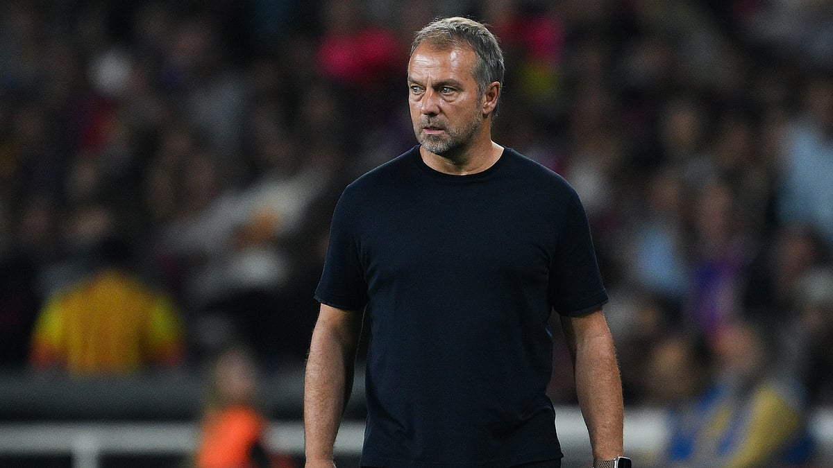 Hansi Flick looks on during Barcelona's midweek win over Getafe