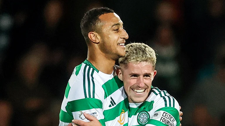 Adam Idah and Luke McCowan celebrate Celtic's sixth goal against St Johnstone - null