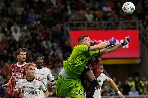 Serie A 2024-25, AC Milan vs Lecce: Lecce's goalkeeper Wladimiro Falcone punches the ball out