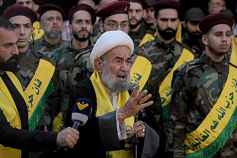 Israel-Hezbollah War: Shiite cleric Hussein Surour speaks during the funeral procession of his son