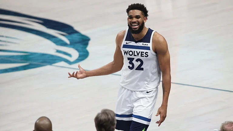 Karl-Anthony Towns #32 of the Minnesota Timberwolves reacts during the fourth quarter against the Dallas Mavericks in Game Four of the Western Conference Finals at American Airlines Center on May 28, 2024 in Dallas, Texas. - null