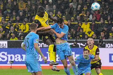 German Bundesliga 2024-25, Borussia Dortmund vs VfL Bochum: Dortmund's Serhou Guirassy, up, heads the ball to score his side's first goal