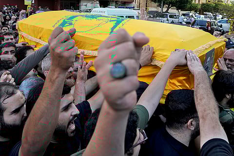 Israel-Hezbollah War: Mourners chant slogans as they carry the coffin of Mohammed Hussein Surour