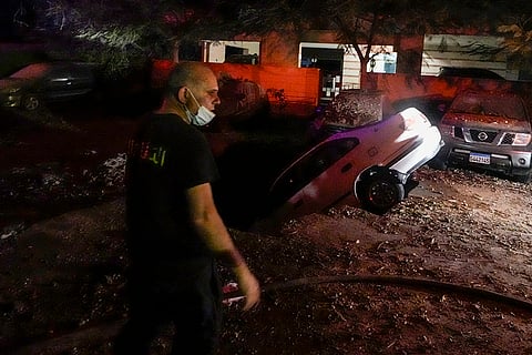 Israel-Hezbollah War: A civil defense member walks at the site of an Israeli airstrike