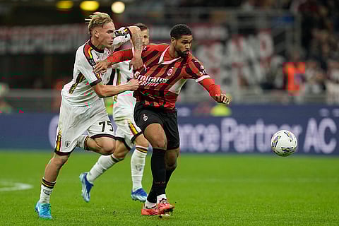 Serie A 2024-25, AC Milan vs Lecce: Lecce's Balthazar Pierret, left, and AC Milan's Ruben Loftus-Cheek fight for the ball