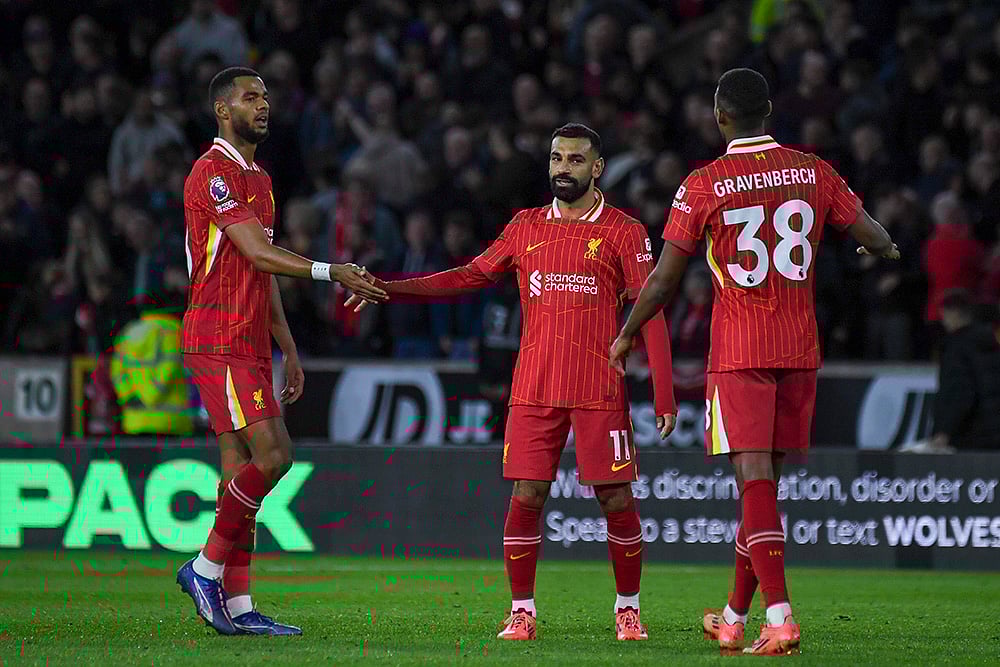 | Photo: AP/Rui Vieira : English Premier League 2024-25, Wanderers vs Liverpool: Liverpool's Cody Gakpo, left, Mohamed Salah, center, and Ryan Gravenberch celebrate their team's victory 