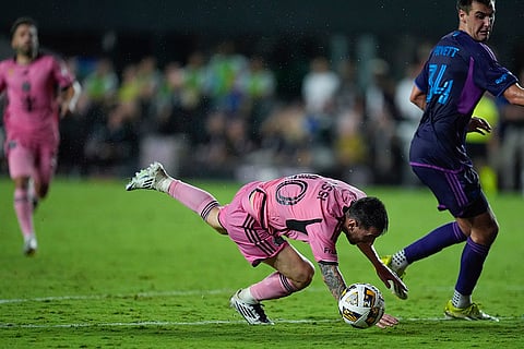 MLS, Inter Miami vs Charlotte FC: Inter Miami forward Lionel Messi (10) falls after a collision with defenders as Charlotte FC midfielder Andrew Privett