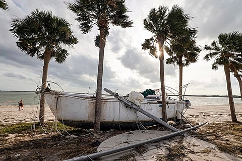 Hurricane Helene: A boat pushed ashore on to the Dunedin Causeway by floodwaters