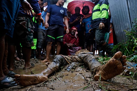 Nepal Floods: People, including relatives, stand by the body of Nandu Sah