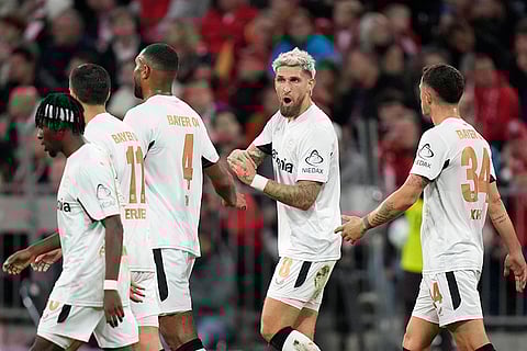 Bundesliga, Bayern Munich vs Leverkusen: Leverkusen's Robert Andrich, center right, talks with teammates after scoring the opening goal