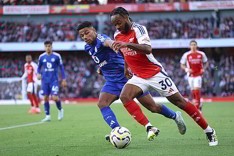 English Premier League 2024-25, Arsenal vs Leicester City: Arsenal's Raheem Sterling, right, challenges for the ball with Leicester's James Justin