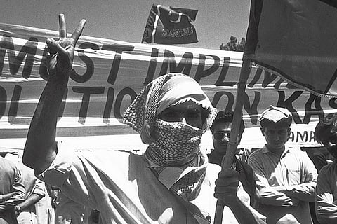 A Jamaat supporter at a rally