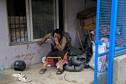 Nepal Floods: A woman cries after she lost her home due to floods