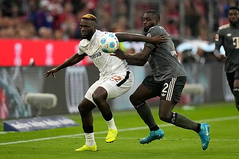 Bundesliga, Bayern Munich vs Leverkusen: Leverkusen's Victor Boniface, left, and Bayern's Dayot Upamecano vie for the ball