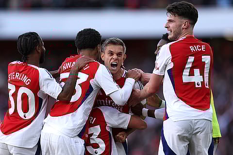 English Premier League 2024-25, Arsenal vs Leicester City: Arsenal's Leandro Trossard, centre, celebrates with teammates after scoring his side's third goal