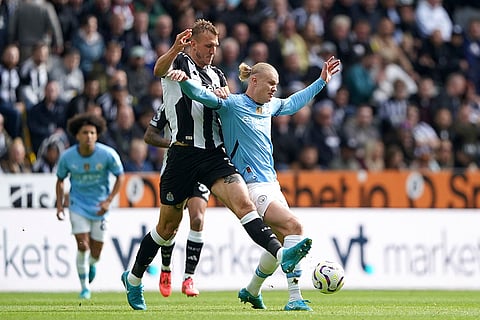 EPL 2024-25, Newcastle vs Manchester City: Newcastle United's Dan Burn, left, and Manchester City's Erling Haaland battle for the ball