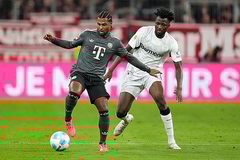 Bundesliga, Bayern Munich vs Leverkusen: Bayern's Serge Gnabry, left, and Leverkusen's Edmond Tapsoba vie for the ball