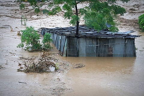 Nepal Floods: A tin shed lies partially submerged