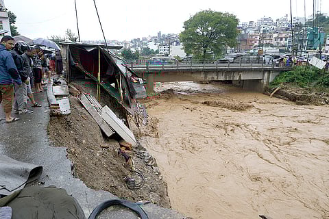 Nepal Floods: People gather at the edge of the Bagmati River