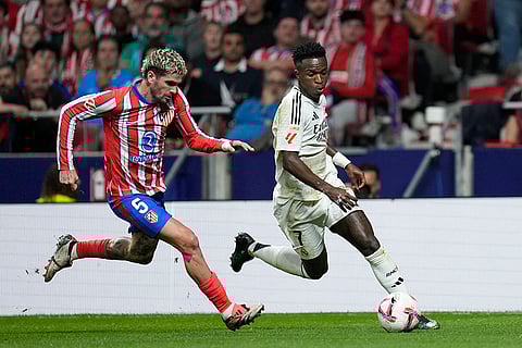 La Liga 2024-25 Atletico Madrid vs Real Madrid: Real Madrid's Vinicius Junior in action in front of Atletico Madrid's Rodrigo De Paul