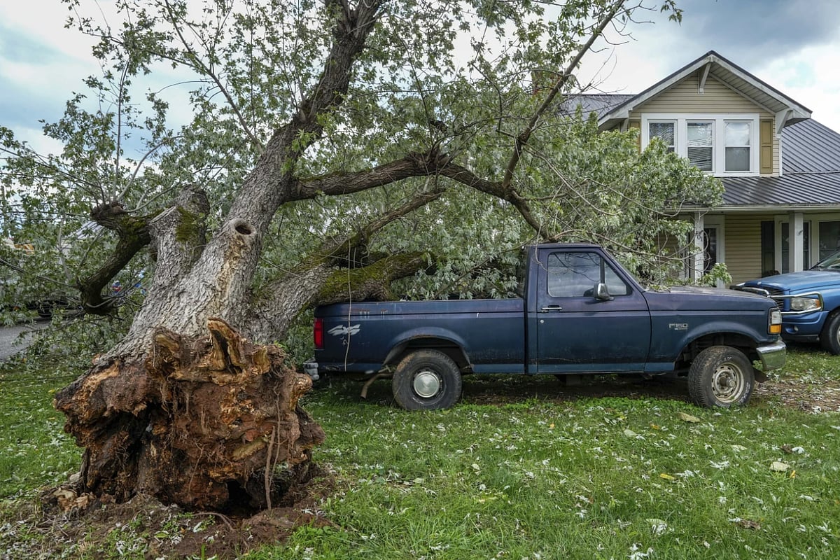 Rescue teams are working to reach stranded residents, but blocked roads and power outages continue to hamper relief efforts.  - AP
