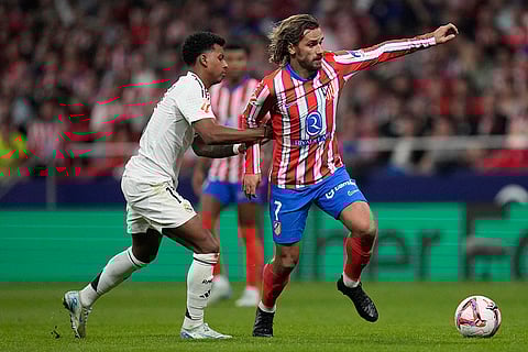 La Liga 2024-25 Atletico Madrid vs Real Madrid: Real Madrid's Rodrygo holds Atletico Madrid's Antoine Griezmann