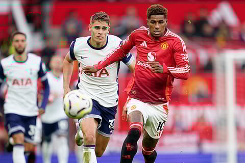 EPL 2024-25 Man United Vs Tottenham: Manchester United's Marcus Rashford, right, challenges for the ball with Tottenham's Micky van de Ven