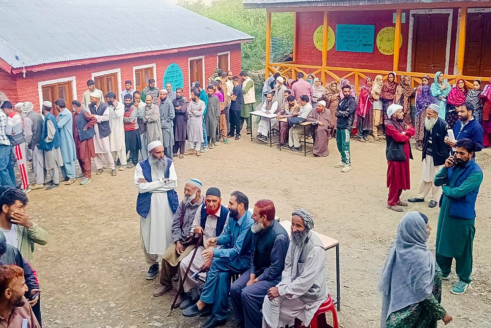| Photo: PTI : 3rd phase of J&K polls: People wait in queues to cast their votes at Sonawari in Bandipora district